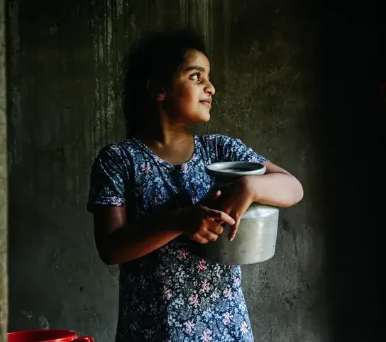 girl holding water jug